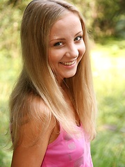 A beautiful teenage babe standing naked on a boat