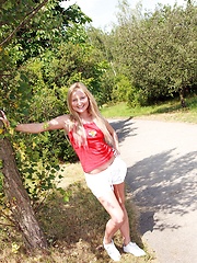 Naughty teenager pleasuring pussy on a public road