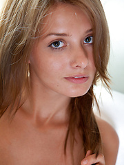 Lovely teen Edwige demonstrates her sexy natural boobs