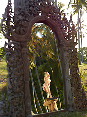 Naked girl photographer photographing her friend in the garden