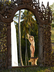 Naked girl photographer photographing her friend in the garden