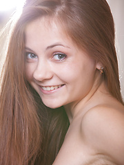 Ennu A bewitching smile, charming blue eyes, and playful appeal