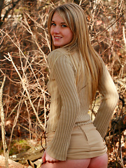 Teen beauty embraces a golden autumn outdoors naked