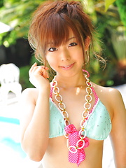 Sexy Japanese honeys pose in tiny bikinis