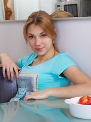 Flexible Alisia strips and eats orange afterwards
